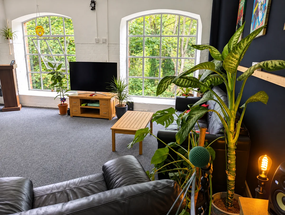 Bright lounge seating area with large arched windows